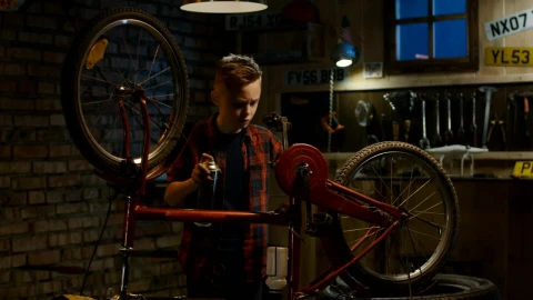 Stock Video Kid Repairs His Bicycle In The Garage Animated Wallpaper - Free Live Wallpaper