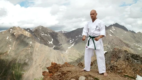 Stock Video Karate Black Belt Stands On Mountain Summit Animated Wallpaper - Free Live Wallpaper
