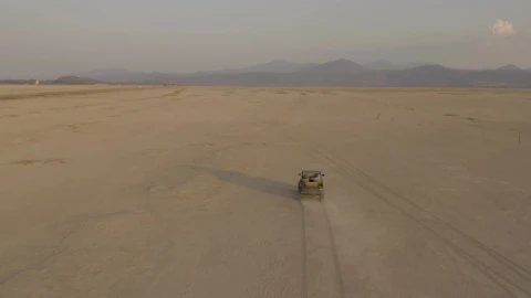 Stock Video Jeep Truck Traveling Through A Desert Seen From The Air Animated Wallpaper - Free Live Wallpaper