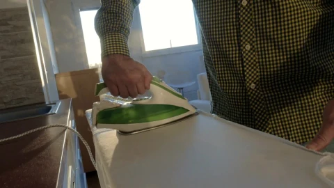 Stock Video Ironing A Shirt At Home Animated Wallpaper - Free Live Wallpaper