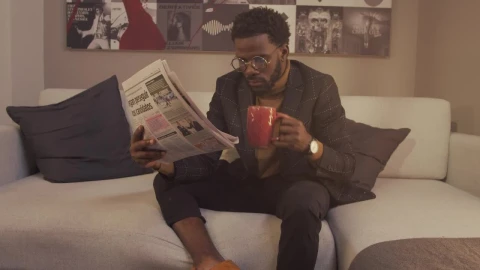 Stock Video Intellectual Man Reading The Newspaper With A Cup Of Coffee Animated Wallpaper - Free Live Wallpaper