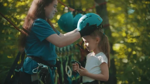 Stock Video Instructor Putting A Protective Helmet On A Little Girl Animated Wallpaper - Free Live Wallpaper
