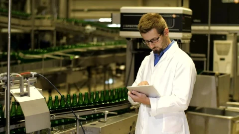 Stock Video Inspector Checking Production Of Beer Bottles Animated Wallpaper - Free Live Wallpaper