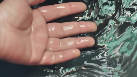 Stock Video Immersing The Hand In Water Seen In Detail Animated Wallpaper - Free Live Wallpaper