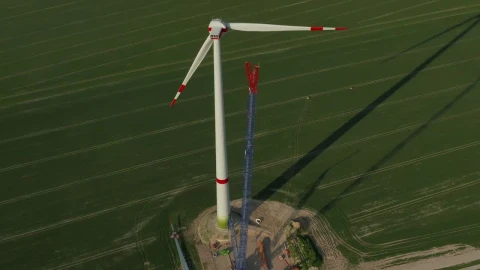 Stock Video Huge Wind Turbine Under Repair Seen From The Air Animated Wallpaper - Free Live Wallpaper