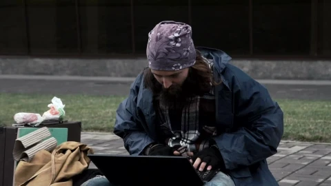 Stock Video Homeless Gets Good News On The Computer Animated Wallpaper - Free Live Wallpaper