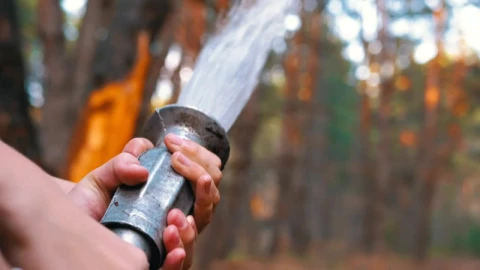 Stock Video Holding A Fire Hose Throwing Water Animated Wallpaper - Free Live Wallpaper