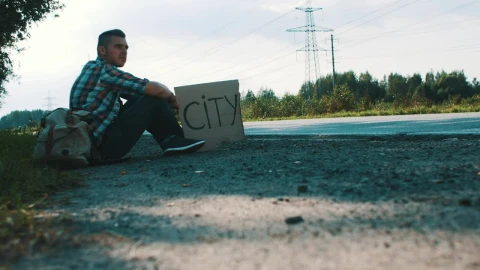Stock Video Hitchhiker With A Cardboard Sign Animated Wallpaper - Free Live Wallpaper