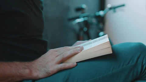 Stock Video Hipster Reading A Book Next To A Bicycle Animated Wallpaper - Free Live Wallpaper