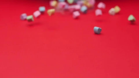 Stock Video Heart Candies Sliding On A Red Surface Animated Wallpaper - Free Live Wallpaper