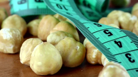 Stock Video Hazelnuts And Measuring Tape Macro Animated Wallpaper - Free Live Wallpaper
