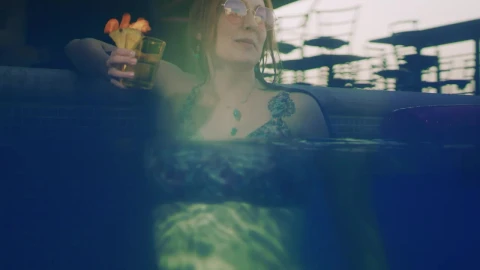 Stock Video Happy Young Woman Enjoying A Cocktail In The Pool Animated Wallpaper - Free Live Wallpaper