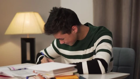 Stock Video Happy Young Man Writing With Pen And Paper Animated Wallpaper - Free Live Wallpaper