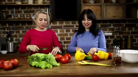 Stock Video Happy Women Cutting Vegetables At Home Animated Wallpaper - Free Live Wallpaper