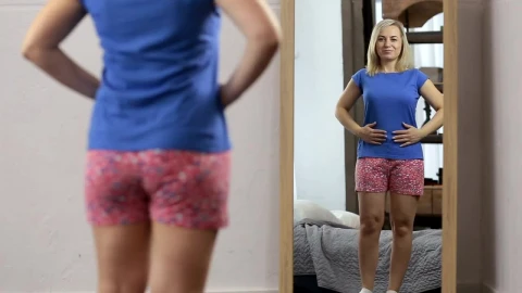 Stock Video Happy Woman While She Looks In The Mirror Animated Wallpaper - Free Live Wallpaper