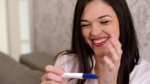 Stock Video Happy Woman Smiles When Checking That She Is Pregnant Animated Wallpaper - Free Live Wallpaper