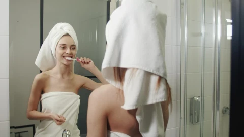 Stock Video Happy Woman Brushing Her Teeth In Her Morning Routine Animated Wallpaper - Free Live Wallpaper