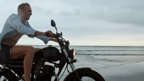 Stock Video Happy Wanderlust Riding A Motorcycle At The Beach Animated Wallpaper - Free Live Wallpaper