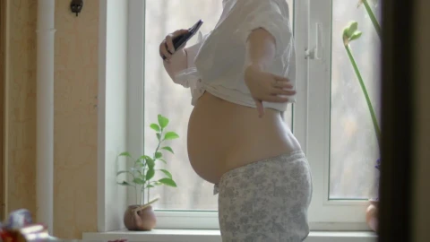Stock Video Happy Pregnant Woman By The Window Animated Wallpaper - Free Live Wallpaper