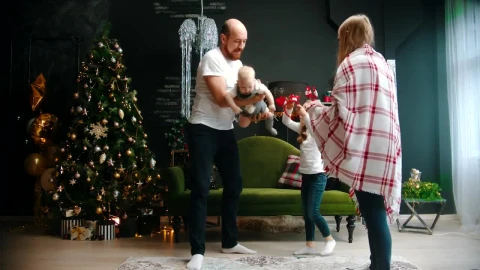 Stock Video Happy Parents Play With Their Daughters At Christmas Animated Wallpaper - Free Live Wallpaper
