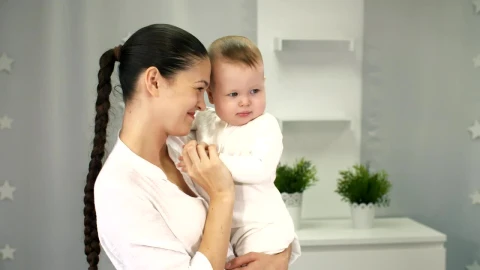 Stock Video Happy Mother Holding Her Little Baby In Arms Animated Wallpaper - Free Live Wallpaper