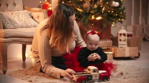 Stock Video Happy Mom With Her Baby On Christmas Night Animated Wallpaper - Free Live Wallpaper