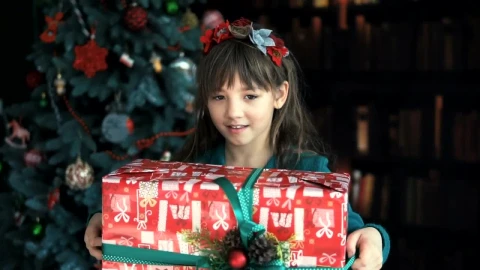 Stock Video Happy Little Girl Waving Her Christmas Gift Animated Wallpaper - Free Live Wallpaper