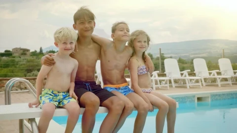 Stock Video Happy Kids Sit On Diving Board Of Pool Posing For Animated Wallpaper - Free Live Wallpaper