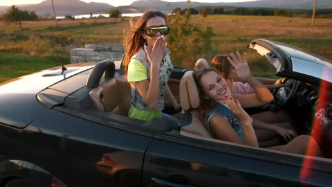 Stock Video Happy Girls Traveling In A Convertible Car At Sunset Animated Wallpaper - Free Live Wallpaper
