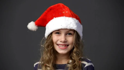 Stock Video Happy Girl Wearing A Christmas Hat Animated Wallpaper - Free Live Wallpaper