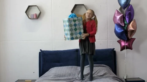 Stock Video Happy Girl Jumping On Her Bed With A Gift Animated Wallpaper - Free Live Wallpaper