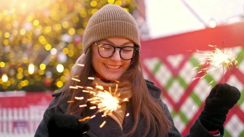 Stock Video Happy Girl Holding Sparkles At Christmas Animated Wallpaper - Free Live Wallpaper