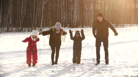 Stock Video Happy Family Jumps In The Snow In A Forest Animated Wallpaper - Free Live Wallpaper