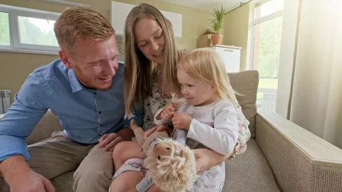 Stock Video Happy Family In An Armchair In Their New House Animated Wallpaper - Free Live Wallpaper