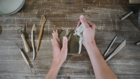 Stock Video Hans Molding Clay In The Workshop Table Animated Wallpaper - Free Live Wallpaper