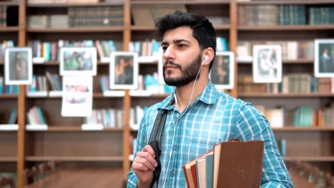 Stock Video Handsome Smiling University Student With Books Animated Wallpaper - Free Live Wallpaper