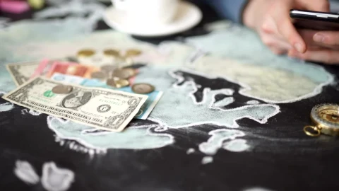 Stock Video Hands Using Mobile On Map With Money And Compass Animated Wallpaper - Free Live Wallpaper