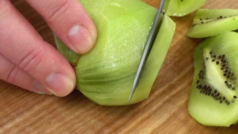 Stock Video Hands Slicing A Kiwi Animated Wallpaper - Free Live Wallpaper