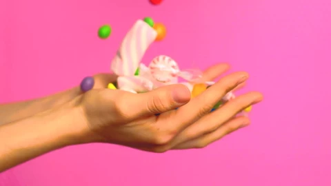 Stock Video Hands Of A Person Full Of Sweets On A Pink Animated Wallpaper - Free Live Wallpaper