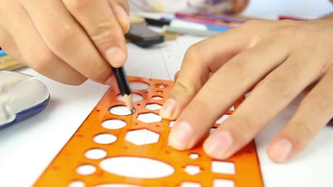 Stock Video Hands Of A Person Drawing Circles With A Template Animated Wallpaper - Free Live Wallpaper