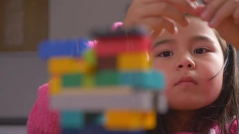 Stock Video Hands Of A Girl Putting Together A Figure With Legos Animated Wallpaper - Free Live Wallpaper
