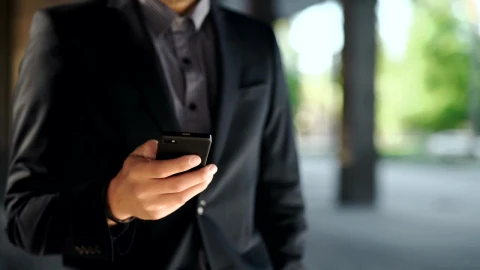 Stock Video Man In Suit Checks Time And Makes Phone Call Animated Wallpaper - Free Live Wallpaper