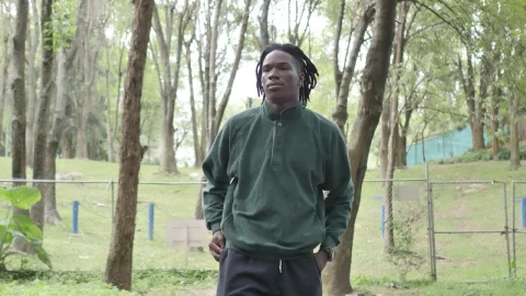 Stock Video Man In Sportswear Walking Through A Park Animated Wallpaper - Free Live Wallpaper