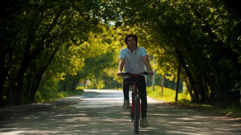 Stock Video Man In Riding A Bike Stops To Put On His Animated Wallpaper - Free Live Wallpaper