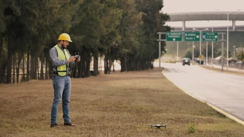Stock Video Man In Hard Hat Flying Drone On Side Of The Animated Wallpaper - Free Live Wallpaper
