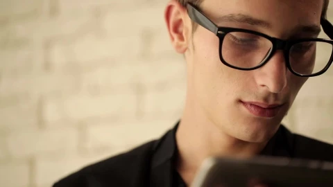 Stock Video Man In Glasses Working On His Tablet Animated Wallpaper - Free Live Wallpaper