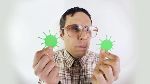Stock Video Man In Glasses Looking At Forms Of Coronavirus Animated Wallpaper - Free Live Wallpaper