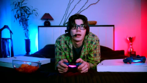 Stock Video Man In Bed Playing Video Games Online Animated Wallpaper - Free Live Wallpaper