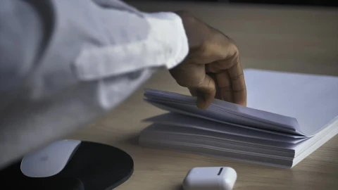 Stock Video Man In An Office Taking A White Sheet Of Paper Animated Wallpaper - Free Live Wallpaper