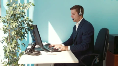 Stock Video Man In A Suit Working In An Office With A Animated Wallpaper - Free Live Wallpaper